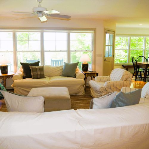 Living room:  the home has a super comfy living room with a wood fireplace and great view of the backyard, long lake, and sleeping bear dunes in the distance.