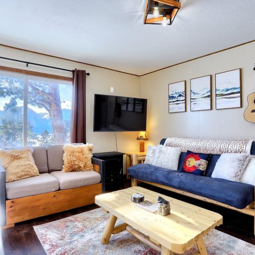 The cozy living room area perfect for doing work, talking,  playing games, or simply relaxing.