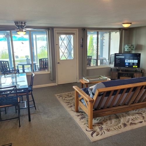 Living room:  cozy living room with a futon, chair, streaming television, and a great view of van etten lake!