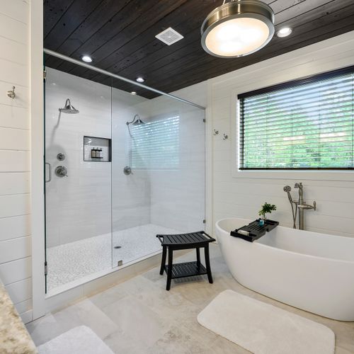 The private bathroom is equipped with an oversized tub and walk-in shower!