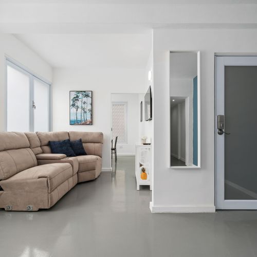 Enjoy our spacious living area adorned with soft hues and contemporary design.