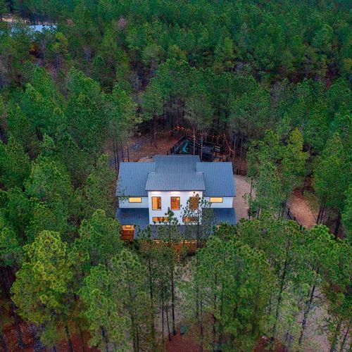 A birds eye view of Bourbon Basin and the towering pines.