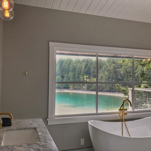 Master bedroom bathroom with Jack and Jill marble sink vanities and slipper tub