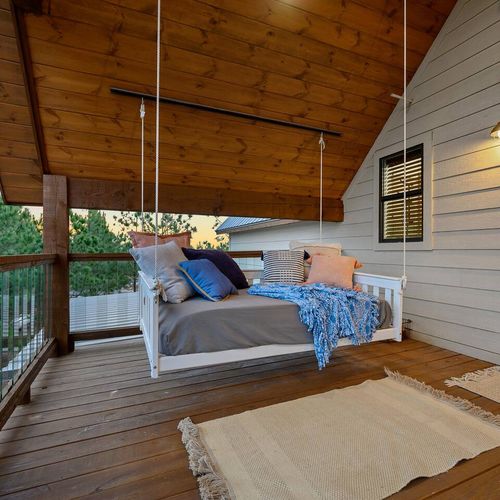 A swinging daybed on the private balcony.