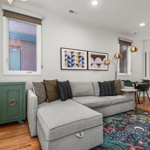 Sunlit living space blending comfort, clean lines, and a welcoming city-home feel