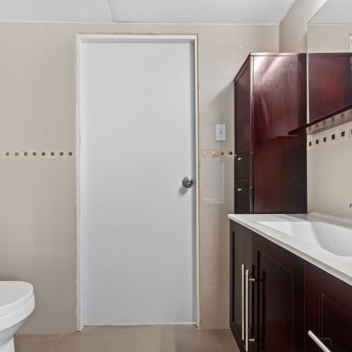 Modern cabinet sink design, showcasing a sleek, minimalist vanity with integrated storage.