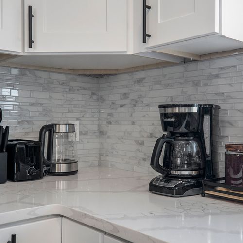 The coffee corner in the kitchen is perfectly equipped for your morning brew, featuring a coffee maker and all the essentials for a delightful start to your day.