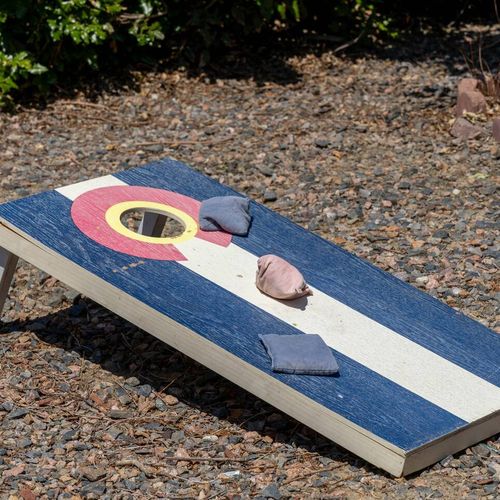 Challenge your crew to a classic cornhole showdown in the backyard.