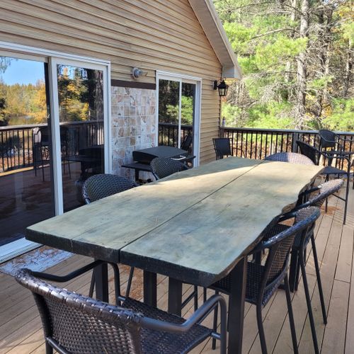 Exterior:  the second floor deck, highlighting the outdoor dining furniture.