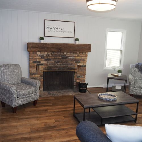 Living room #2:  very cozy with sofa, fireplace, comfy chairs, and live streaming television.