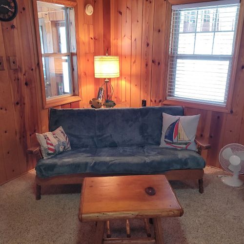 Living room:  very cozy and comfy living room with two sofas, two comfy chairs, a coffee table, and a gas fireplace.