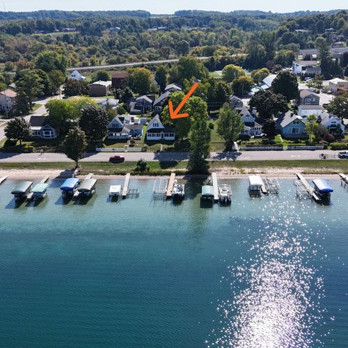 OVERVIEW:  Aerial view from over Crystal Lake showing the location of the cottage via the orange arrow.