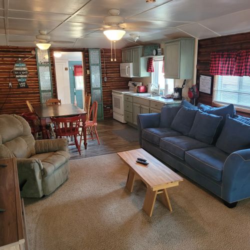 Living room:  large and comfy living room with a sofa, comfy chair, coffee table, and streaming television.