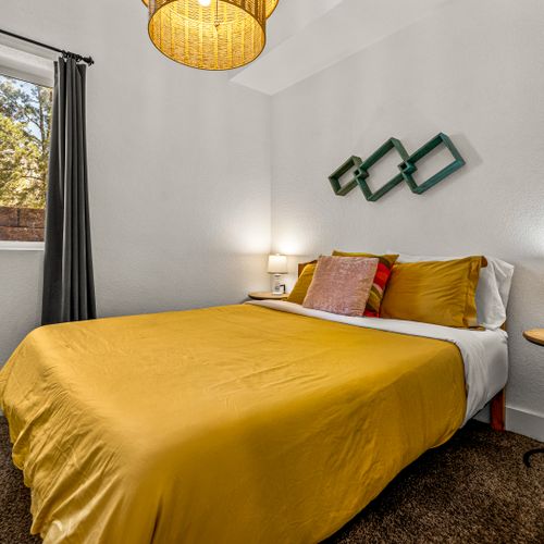 Soft carpeting and clean woodwork bring peaceful energy to a space made for rest.
