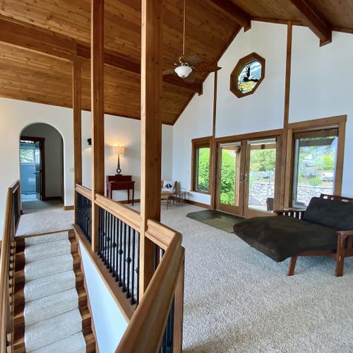 A large loft area for reading, yoga, remote work. Outdoor seating and terraced rock gardens are just outside.