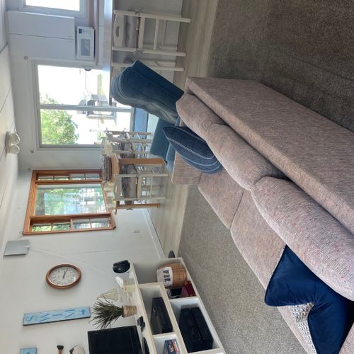 Living room:  the cottage has a very comfy and cozy living room with a sofa, loveseat, comfy chair, and television.