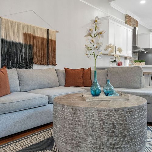 Spacious and stylish, this open-concept living room is perfect for relaxation and entertaining, featuring modern comforts and classic charm in the heart of New Orleans.