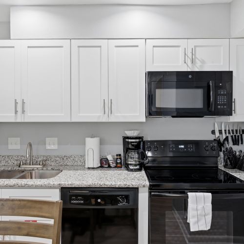 Open kitchen w/ bar seating — great for cooking & catching up together.