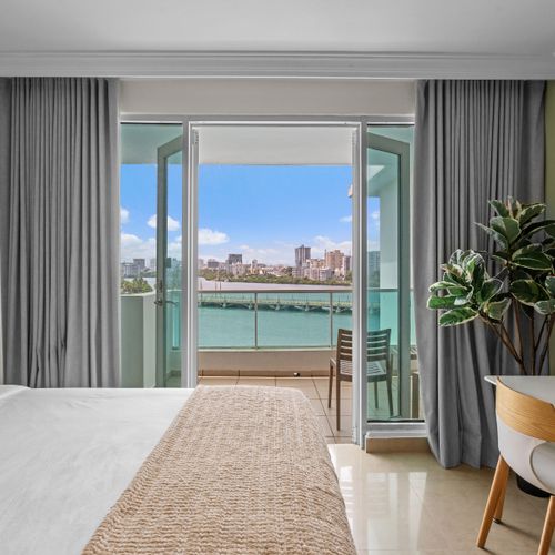 Wake up to stunning lagoon views from your comfortable bedroom, featuring two plush beds for a restful night's sleep