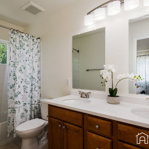 The master bathroom consists of a tub/shower combo and double vanity. Towels and toiletries are provided for your convenience.