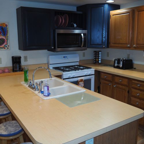 Kitchen:  newly remodeled kitchen with stainless steel appliances, including a dishwasher and microwave.