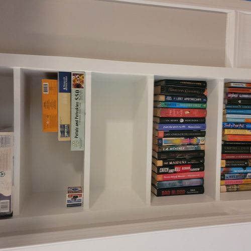 Living room:  there is a good collection of books, games, and puzzles on a shelf in the living room.