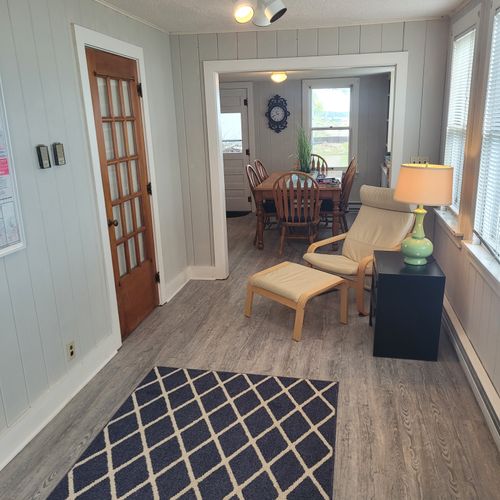 Beach house - living room:  not very large, but comfy with incredible views of lake huron! Great for reading and relaxing!