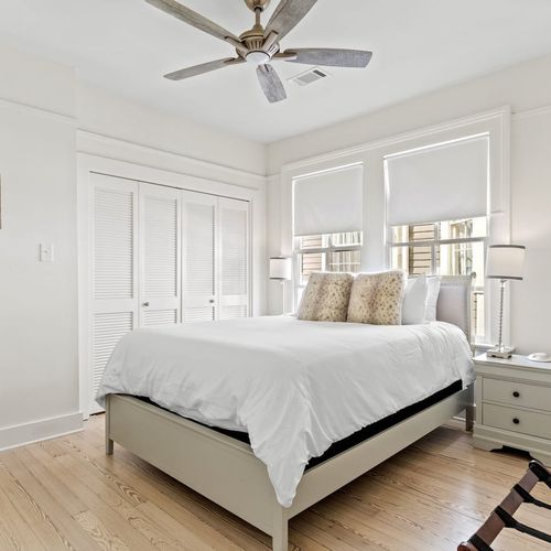 Light-filled second bedroom w/ a desk & closet space.