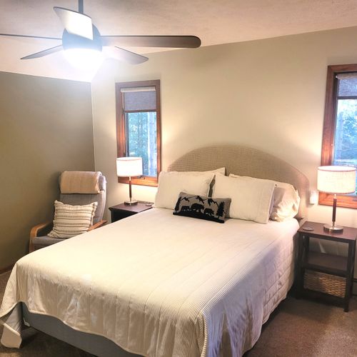 BEDROOM #2 (SECOND FLOOR):  Super cute bedroom with a queen-size bed, ceiling fan, cubby area, closet, dresser, and mirror.