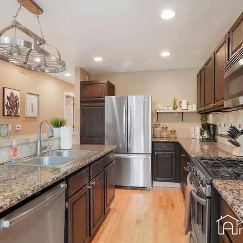 Our fully stocked kitchen is equipped with sleek stainless steel appliances and everything you need to whip up a delicious meal.