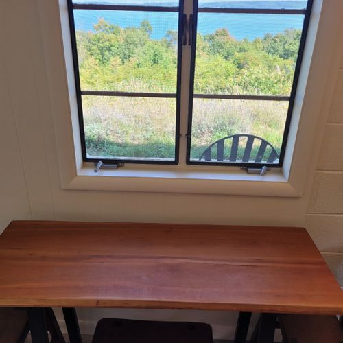 Kitchen:  the home has a very cute and newly updated kitchen with all appliances, including a dishwasher. Also includes a small breakfast nook with stools and a great view of crystal lake!