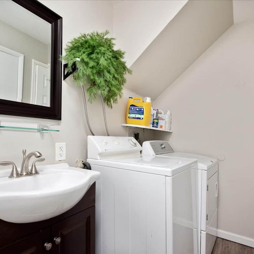 The downstairs bathroom is also the laundry room with a washer and dryer for use during your stay.