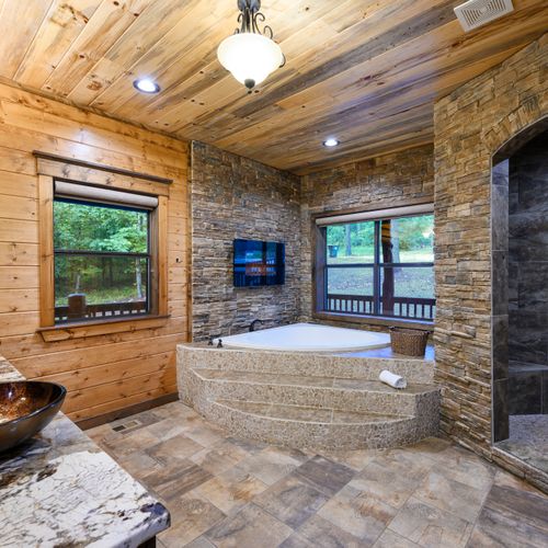 The private bathroom has a huge soaking tub and a walk-in shower.