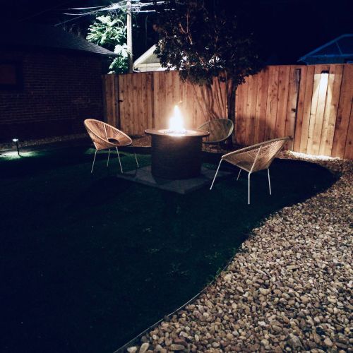 Cozy seating around the crackling outdoor firepit.