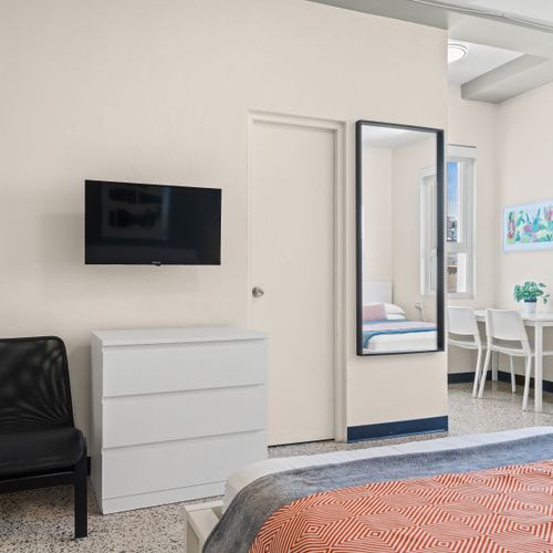 Discover true comfort in our thoughtfully designed bedroom, featuring a pristine bed and tasteful decor, ready for your well-deserved rest after a day of adventures.