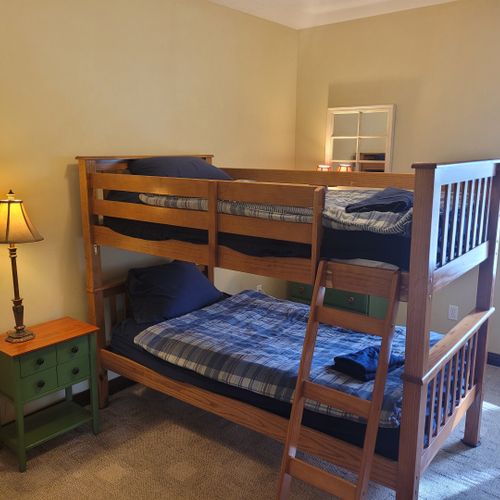 Bedroom #4 (lower level):  includes a twin-on-twin bunk bed, dresser, closet, nightstand, and lamps