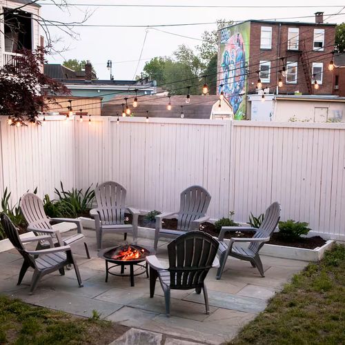 Unwind at night on the bluestone patio, perfect for bonfires under the lights in the heart of Kingston.