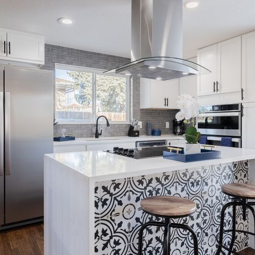 The gorgeous kitchen island is the highlight and centerpiece of this immaculately designed home.