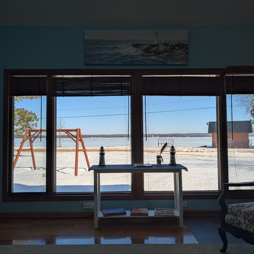 LIVING ROOM #1:  The primary living room, which has a great view of Big Platte Lake!  (Note that the fireplace is not usable.)