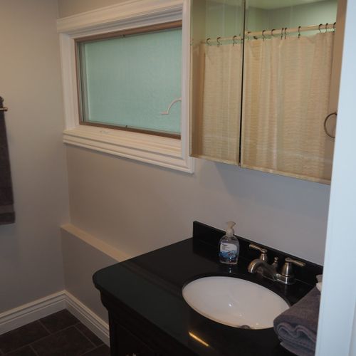 Bathroom #2 (first floor):  full private en suite bathroom for bedroom #2.