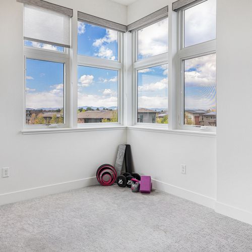 Enjoy ample space and equipment for a full-body workout in this dedicated exercise room.