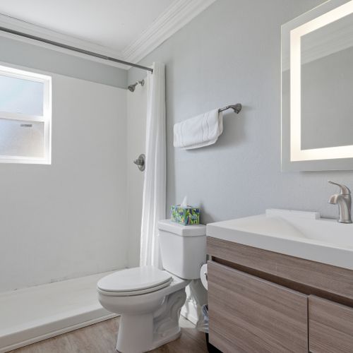 Clean, simple bathroom w/ a fresh, minimal feel.