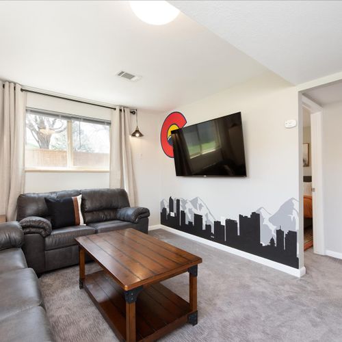 The downstairs living room includes a huge sectional, a 65" smart tv with netflix streaming and plenty of board games.