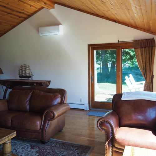Living room:  the cabin has a huge living room with a gas fireplace and 
 great lake views!