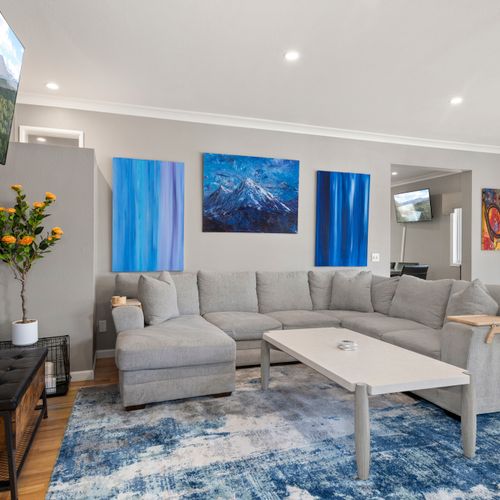 Relax and recharge in this colorful, inviting living room with smart tv.