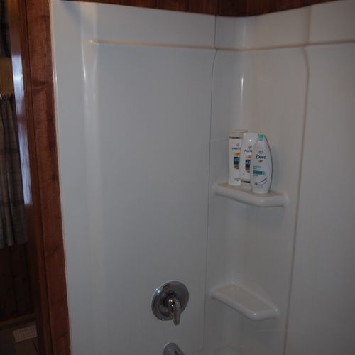 Bathroom (main floor):  the cabin has a full bathroom on the main floor with a combination tub / shower.