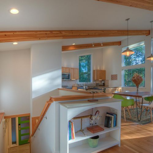 Stairs leading down to the front door and bedrooms below.