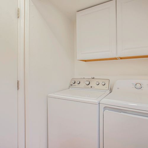 Enjoy the convenience of on-site laundry adjacent to main level half bath, stocked with essentials to refresh your wardrobe.