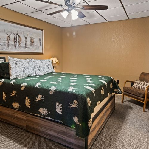 Bedroom #2 (lower level):  features a queen-size bed, chair, desk, closet, and private en-suite full bathroom.