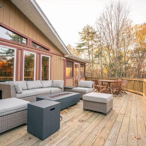 Outdoor lounge area with gas fireplace.